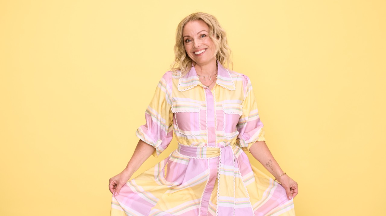 Lisa Walker, co-founder of Eir Women against a light yellow background