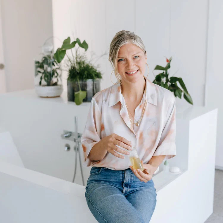 Natalie Butler, founder of biobod holding a biobod serum