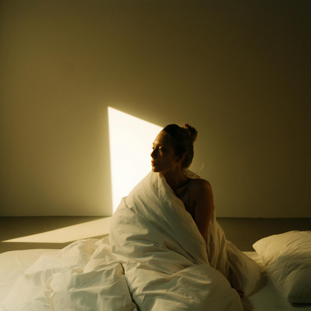 midlife woman sunrise bedroom calm