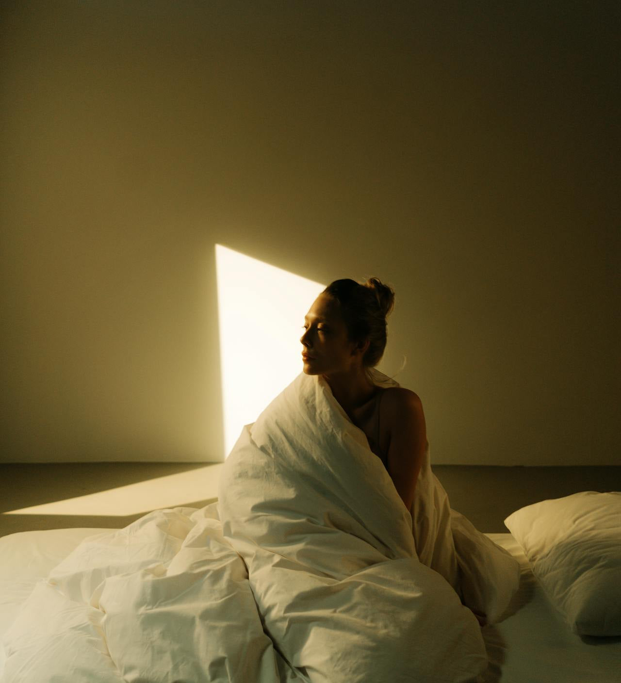 midlife woman sunrise bedroom calm