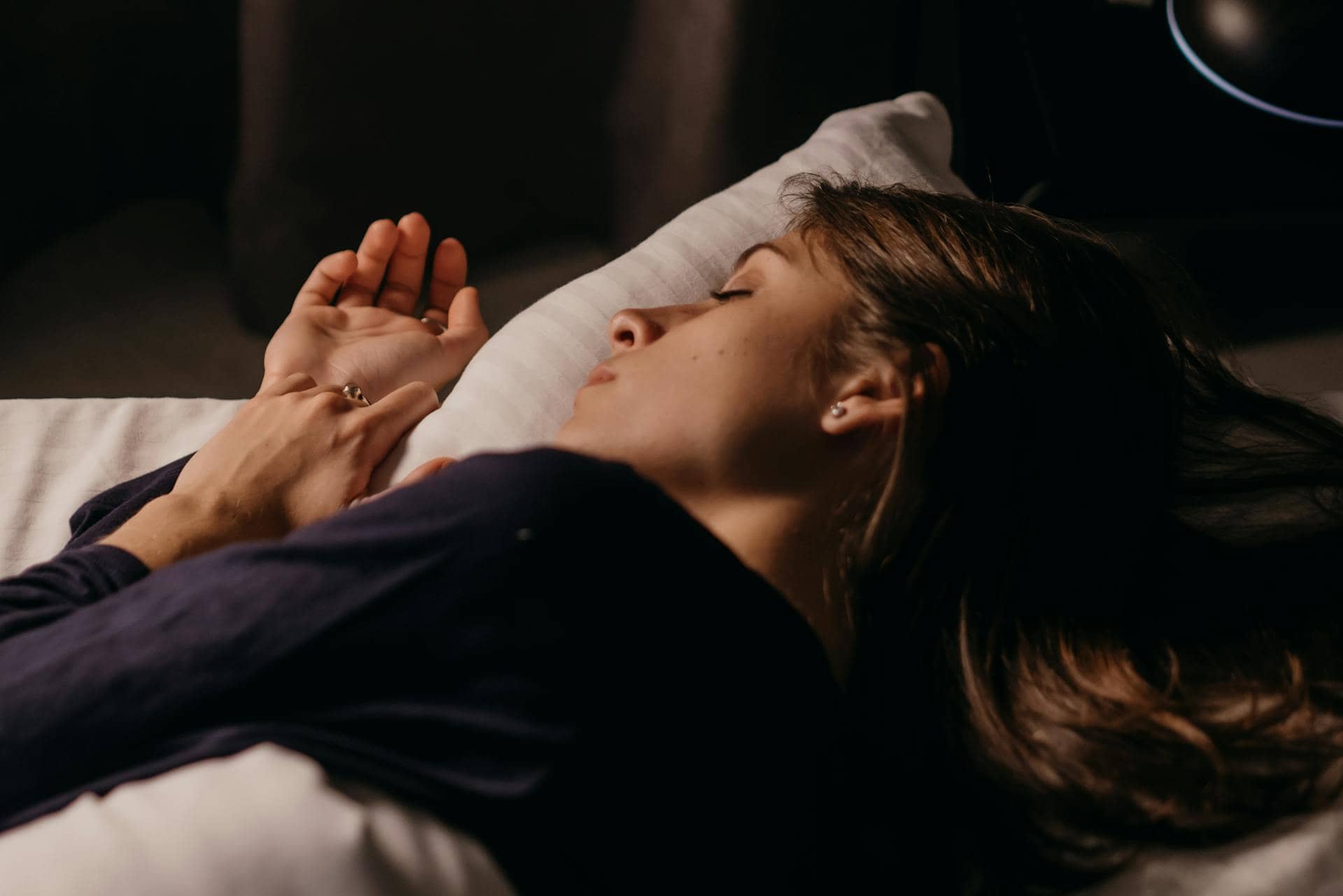 Woman lying on bed sleeping