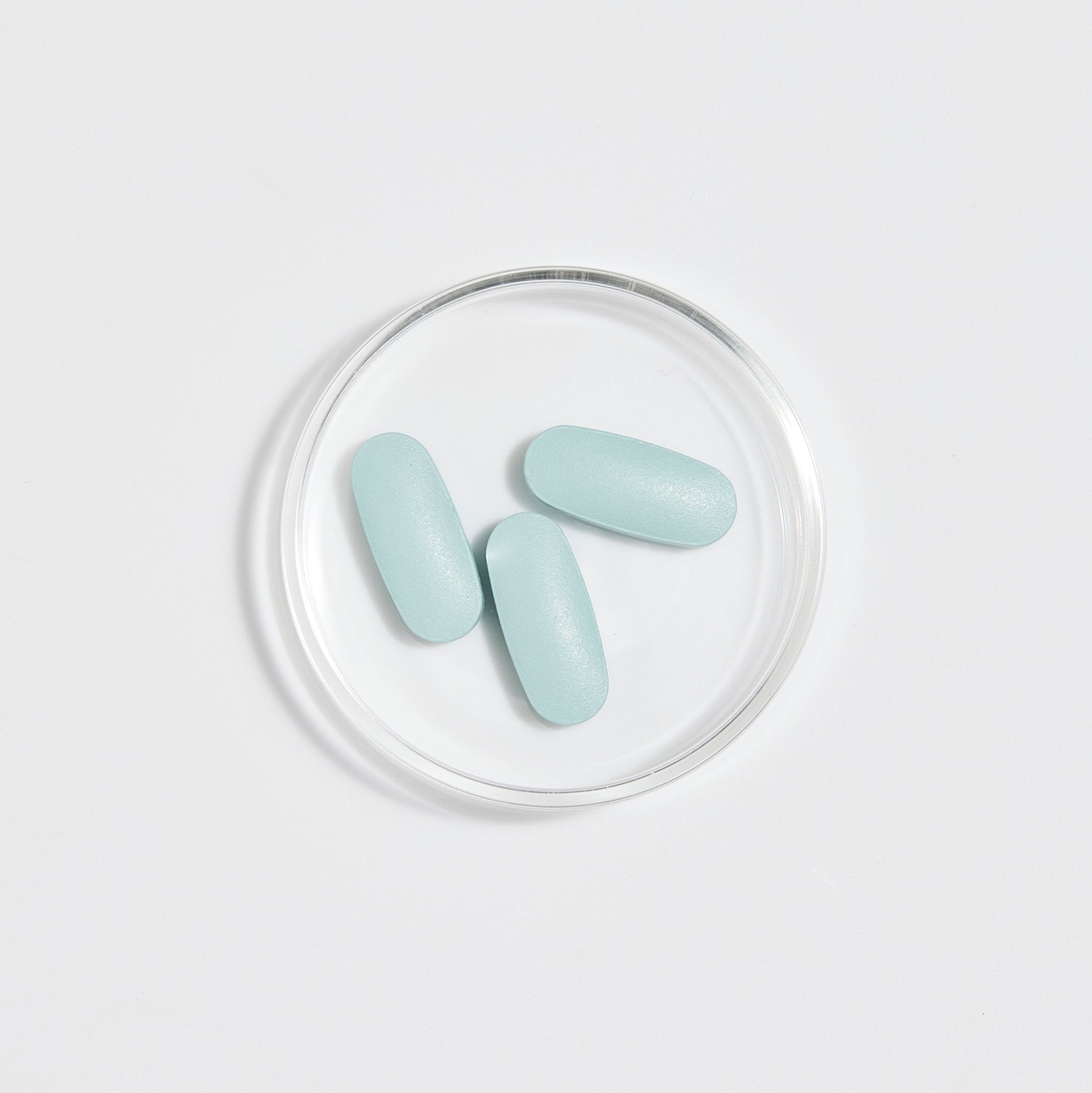 Eir Women Reboot blue tablets sitting in Petri dish