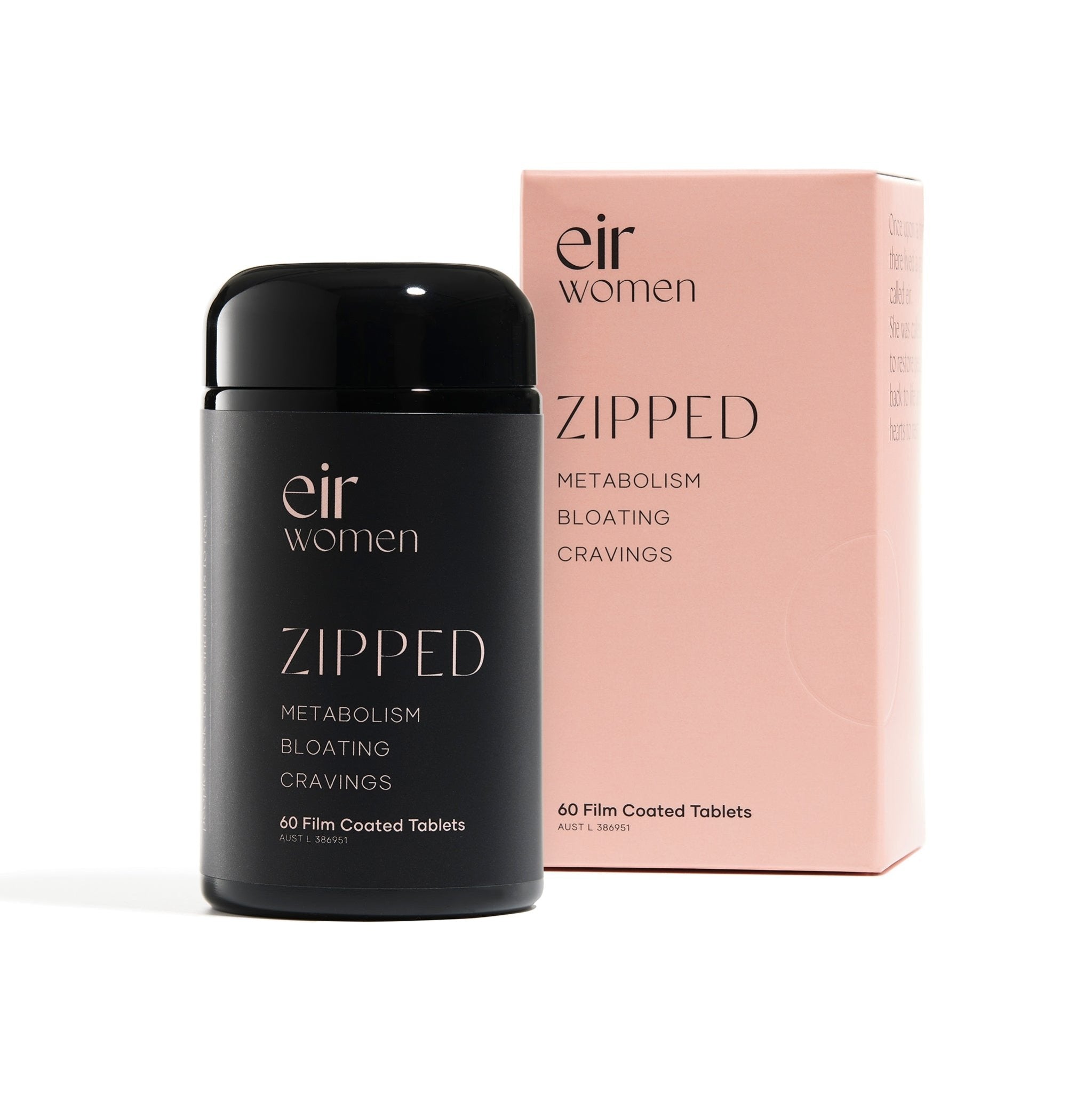 black glass vitamin bottle next to pink carton